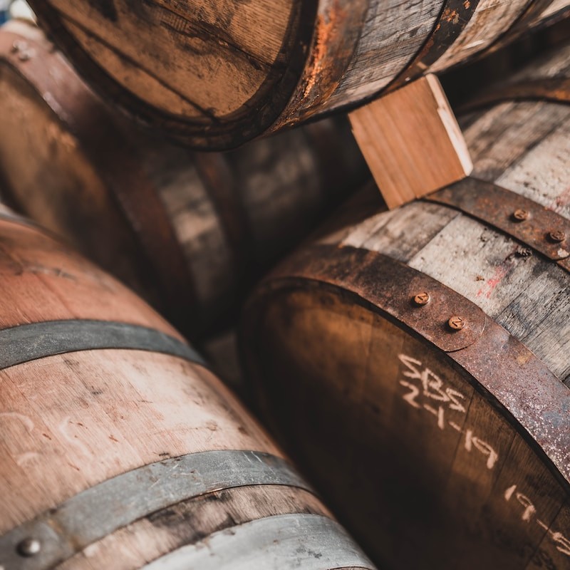 brown wooden barrels on brown wooden floor
